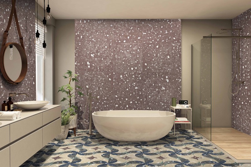 Baño con azulejos efecto terrazo en tonos cálidos, colección Petri de Land