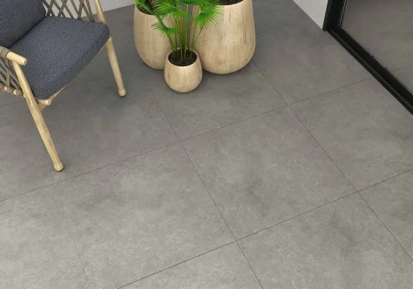Ambiente con azulejos efecto cemento en tonos neutros, colección Infinity de Ecoceramic