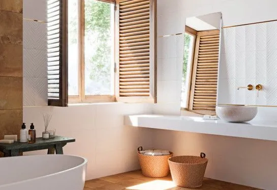 Baño con azulejos efecto barro en tonos cálidos, colección Cotto de Aparici