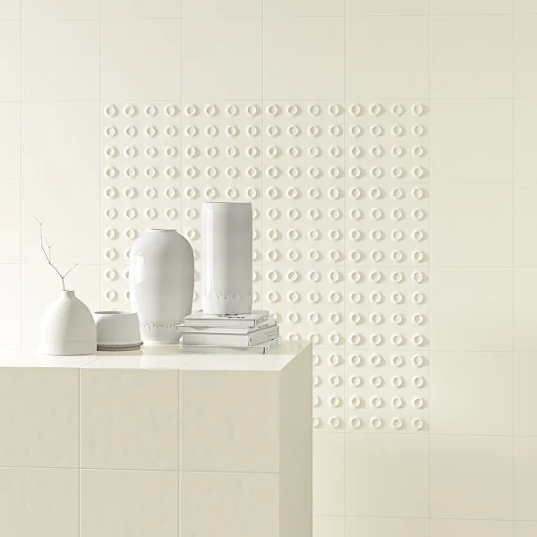Baño con azulejos efecto barro en tonos neutros, colección Rúbrica de Vives