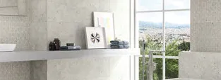 Baño con azulejos efecto cemento en tonos neutros, colección Ama de Ape