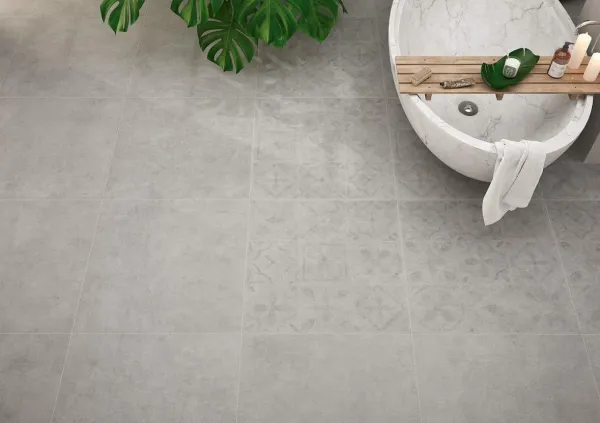 Baño con azulejos efecto cemento en tonos neutros, colección Brera de Bellacasa