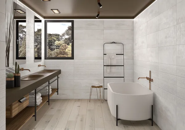 Baño con azulejos efecto cemento en tonos neutros, colección Channel de TAU ceràmica