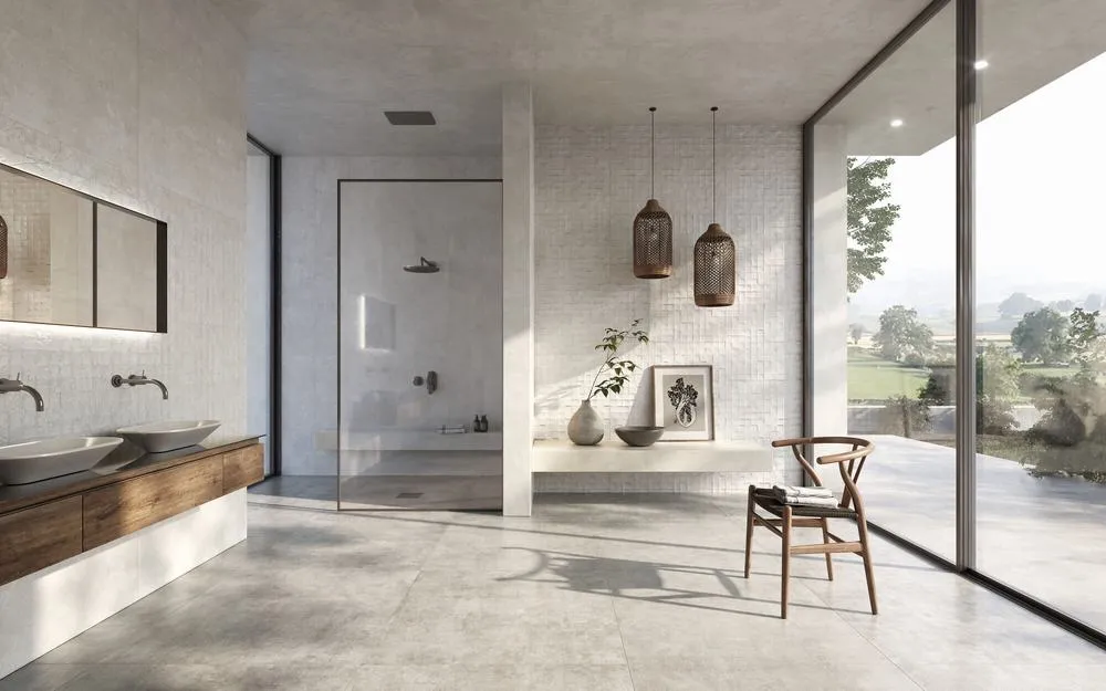 Baño con azulejos efecto cemento en tonos neutros, colección Charme de Peronda