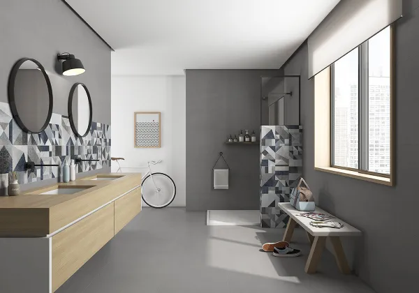 Baño con azulejos efecto cemento en tonos neutros, colección Core de Argenta