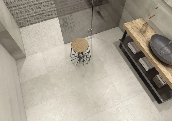 Baño con azulejos efecto cemento en tonos neutros, colección Devon + devon outdoor 20 de TAU ceràmica