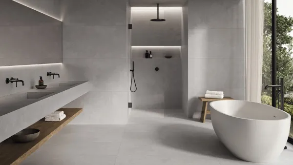 Baño con azulejos efecto cemento en tonos neutros, colección Essenza de Argenta