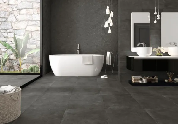 Baño con azulejos efecto cemento en tonos neutros, colección Evo de Fanal