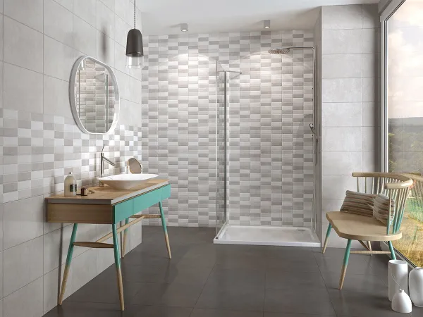 Baño con azulejos efecto cemento en tonos neutros, colección Foster - meier de Argenta