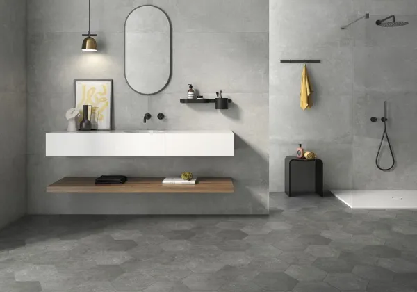 Baño con azulejos efecto cemento en tonos neutros, colección Ground de Geotiles