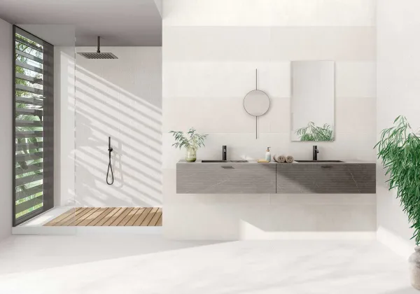 Baño con azulejos efecto cemento en tonos neutros, colección Lema de TAU ceràmica