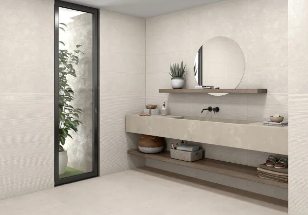 Baño con azulejos efecto cemento en tonos neutros, colección Lille de Mikonos