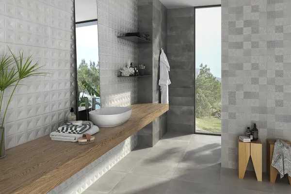 Baño con azulejos efecto cemento en tonos neutros, colección Madox de Halcón