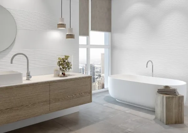 Baño con azulejos efecto cemento en tonos neutros, colección Moma de Grespania