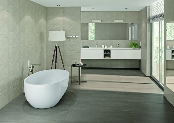 Baño con azulejos efecto cemento en tonos neutros, colección Neutra de Cifre