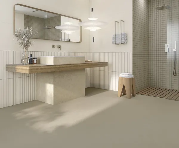 Baño con azulejos efecto cemento en tonos cálidos, colección New york de Vives