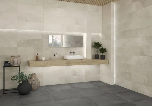 Baño con azulejos efecto cemento en tonos neutros, colección Powder - dust de Argenta