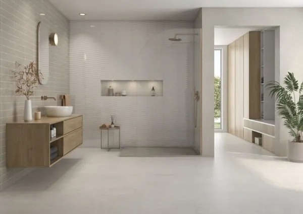 Baño con azulejos efecto cemento en tonos neutros, colección Stucco de TAU ceràmica