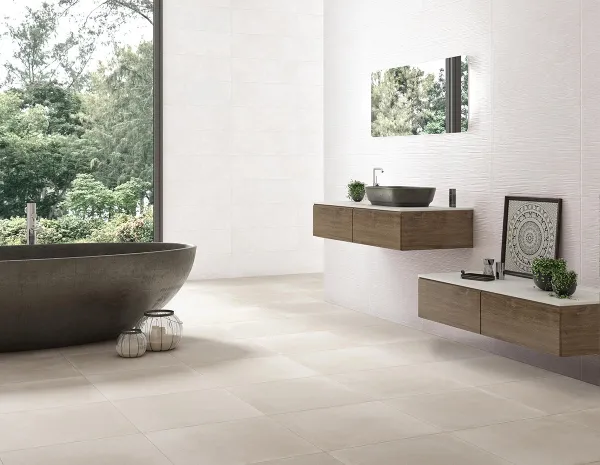 Baño con azulejos efecto cemento en tonos neutros, colección Yaiza de TAU ceràmica