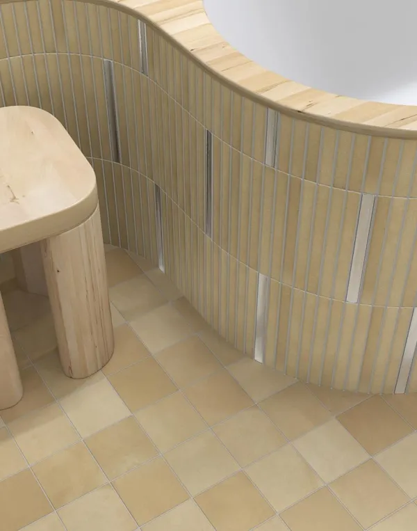 Baño con azulejos efecto hidráulico en tonos cálidos, colección Surf de Vives