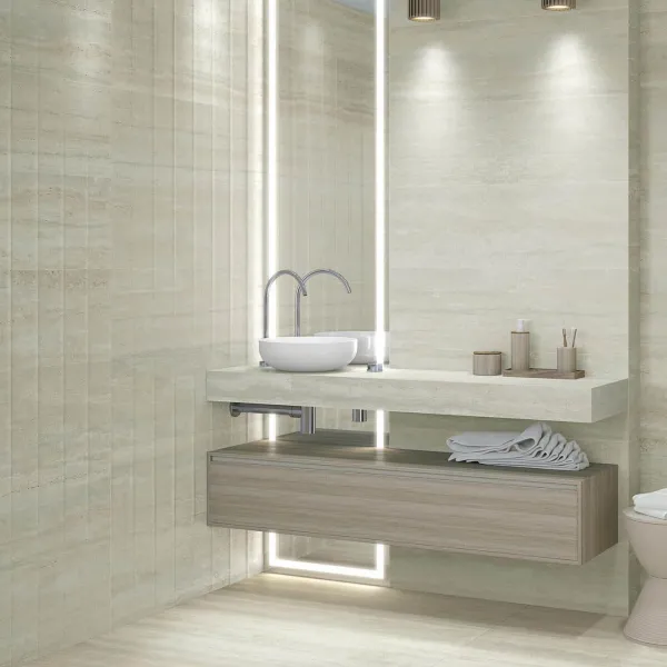 Baño con azulejos efecto mármol en tonos neutros, colección Sentier de Vives
