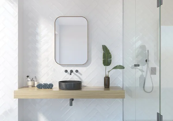 Baño con azulejos efecto monocolor en tonos neutros, colección Aria de Fabresa