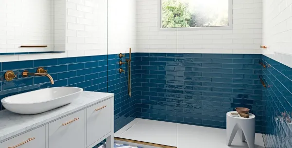 Baño con azulejos efecto monocolor en tonos fríos, colección Gracia de Grespania