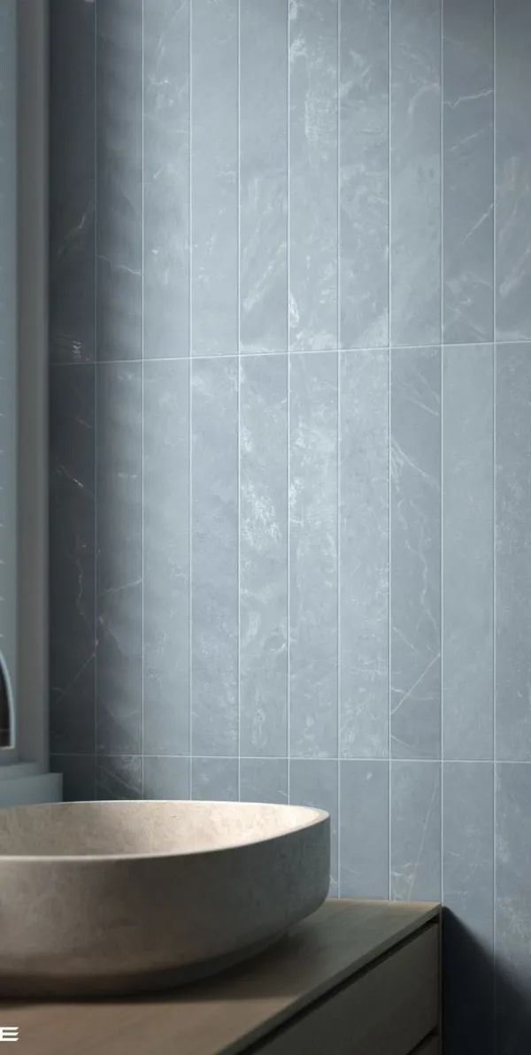 Baño con azulejos efecto monocolor en tonos fríos, colección Marmoris de Equipe