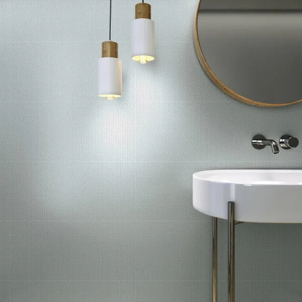 Baño con azulejos efecto monocolor en tonos fríos, colección Pearl de Fanal