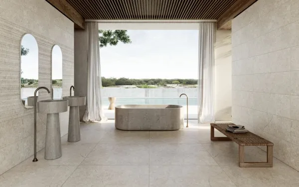 Baño con azulejos efecto piedra, colección Alchemy de Peronda