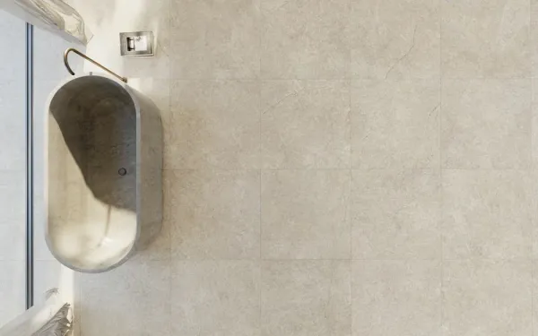 Baño con azulejos efecto piedra, colección Alchemy de Peronda