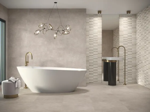 Baño con azulejos efecto piedra, colección Asphalt de Baldocer