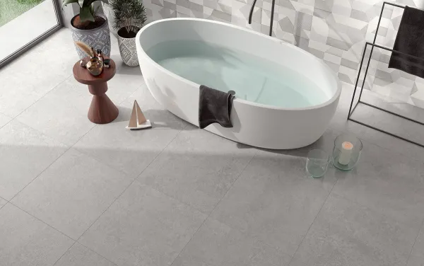 Baño con azulejos efecto piedra en tonos neutros, colección Backstage de Colorker