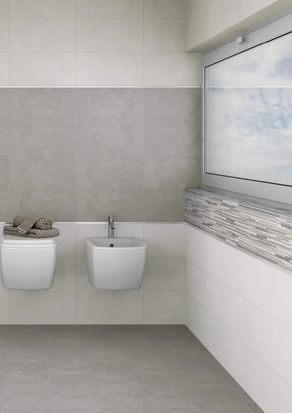 Baño con azulejos efecto piedra en tonos neutros, colección Budapest de Rock Ceramic