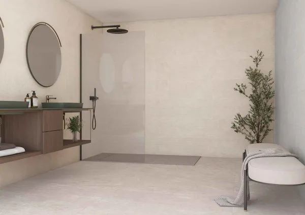 Baño con azulejos efecto piedra, colección Caribbean de TAU ceràmica