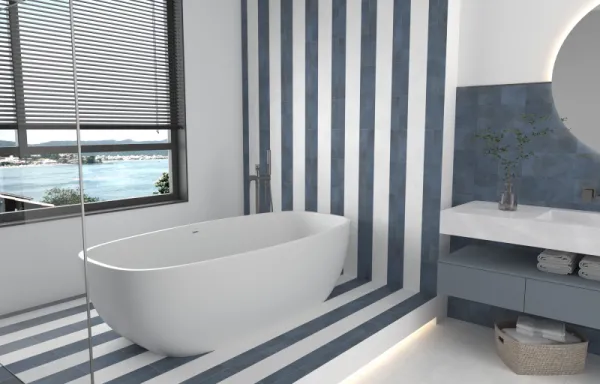 Baño con azulejos efecto piedra en tonos fríos, colección Greenland de Dune