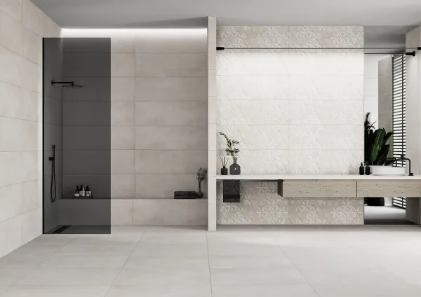 Baño con azulejos efecto piedra en tonos neutros, colección Harlem de Metropol
