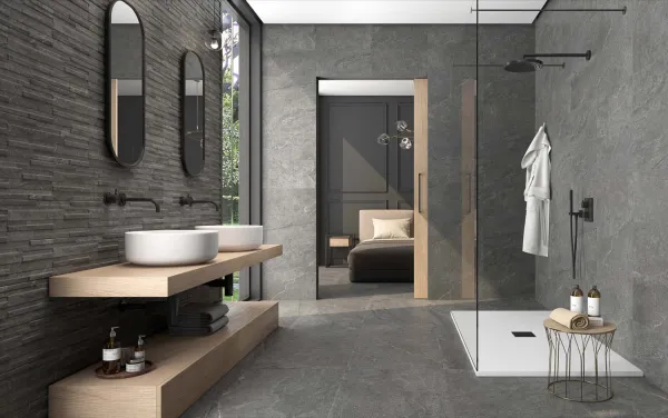 Baño con azulejos efecto piedra en tonos neutros, colección Horizon de Colorker