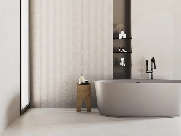 Baño con azulejos efecto piedra en tonos neutros, colección Isola de Metropol