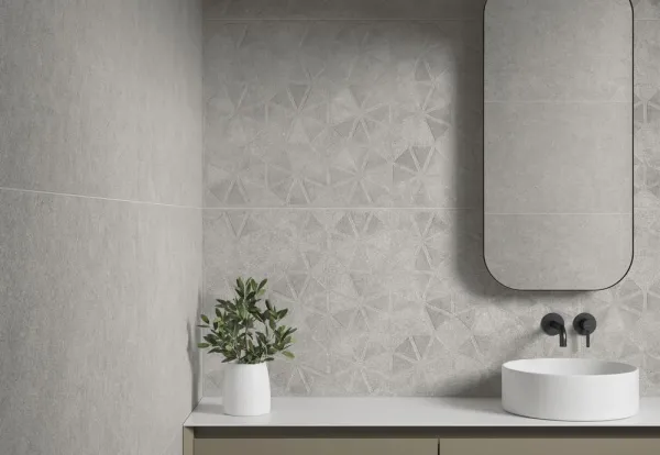 Baño con azulejos efecto piedra en tonos neutros, colección Lowell de Argenta