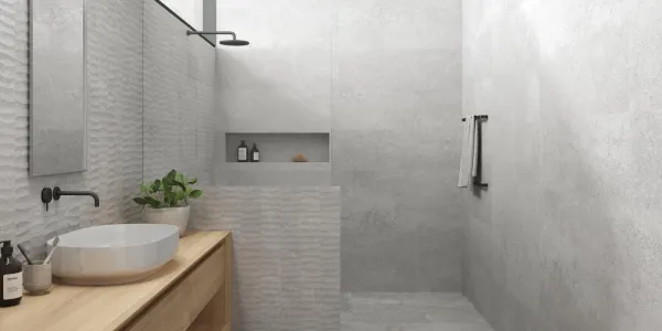 Baño con azulejos efecto piedra en tonos neutros, colección Lucca wall de Peronda
