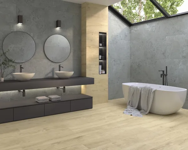Baño con azulejos efecto piedra en tonos neutros, colección Pietra viva de Dune