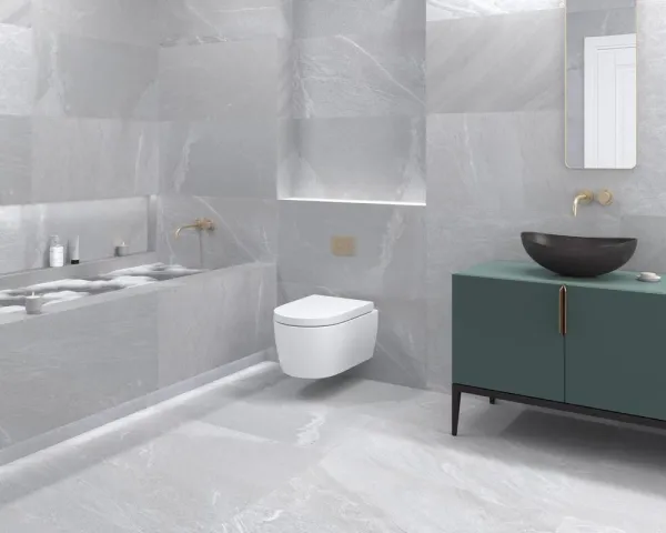 Baño con azulejos efecto piedra, colección Pietrasanta de Dune