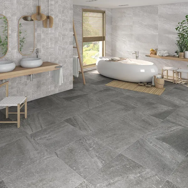 Baño con azulejos efecto piedra en tonos neutros, colección Rho de Vives