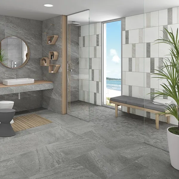 Baño con azulejos efecto piedra en tonos neutros, colección Rho de Vives