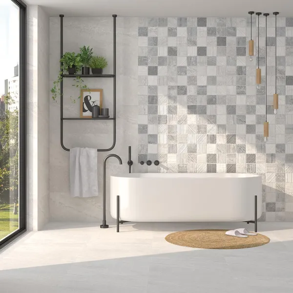 Baño con azulejos efecto piedra en tonos neutros, colección Rho de Vives