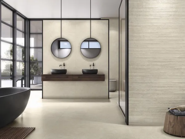 Baño con azulejos efecto piedra, colección Stoneland de Baldocer