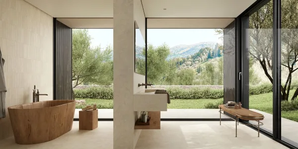 Baño con azulejos efecto piedra en tonos cálidos, colección Tivoli de Marazzi