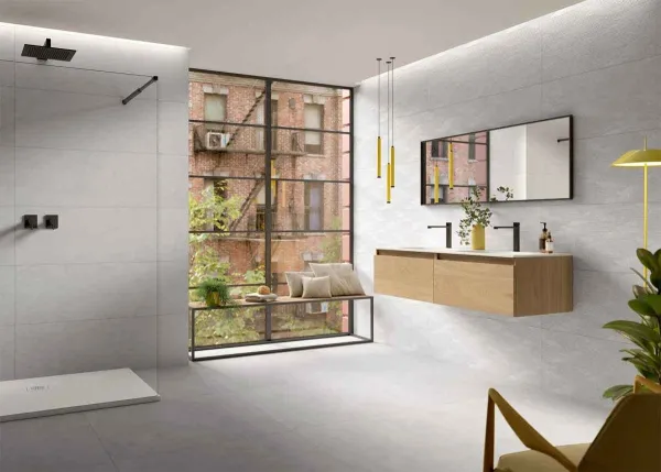 Baño con azulejos efecto piedra en tonos neutros, colección Túnez de Metropol