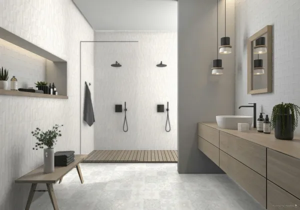 Baño con azulejos efecto terrazo en tonos neutros, colección Goldoni de Argenta